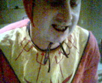 Me in my devil outfit with black eye shadow and black lipstick on, staring downward