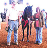 Doble Cuento del Turista 6th place futuriy winner Kim and Greg Willis, owners, Cindy Griffeth, trainer