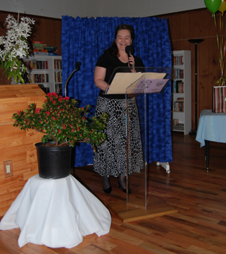 MC Angie Wright begins the program