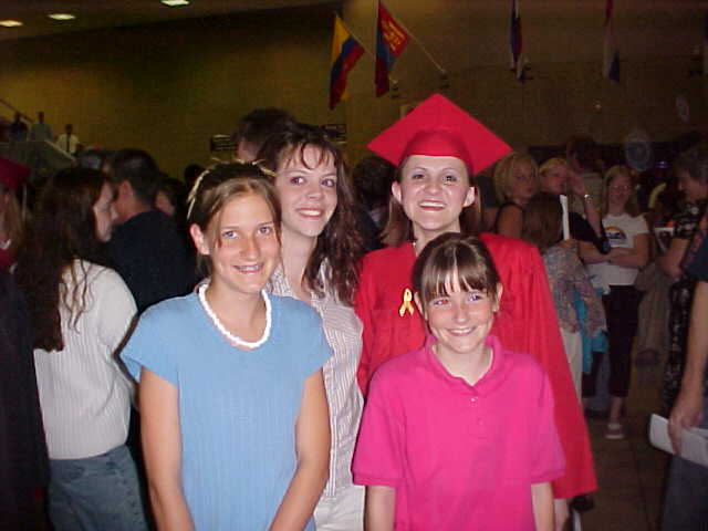 My sisters and me after I graduated.&nbsp; *sigh* One of the few moments we werent trying to kill each other.