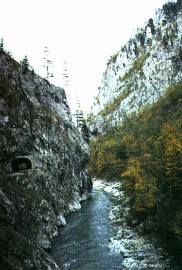 Steep mountains with rivers or streams cutting through them are a common site while motoring through Bosnia