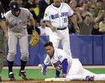 Jose Cruz, Jr slides into third with a triple