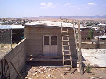 The cement was mixed on the ground and carried by hand.