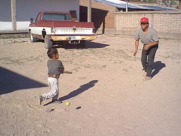 Playing baseball with his son Adrian.