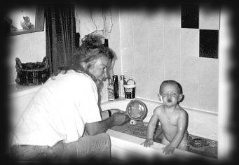 Grandma watching Israella take her bath