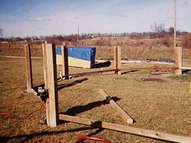 support post being set in piers and cut 