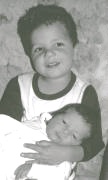 Ethan holding baby Nolan