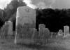 Closeup of tombstone with ghostly image of Confederate soldiers.