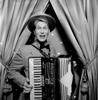 Smiling guy playing accordian