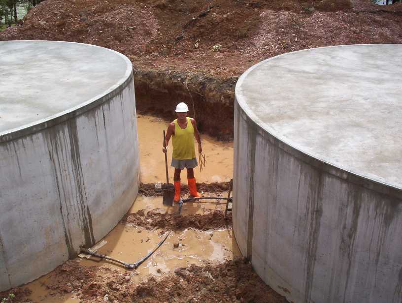 David working between the massive water tanks (180,000 litres), more than enough.