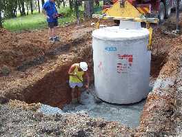 David in the trench levelling off the septic system ready for installation.