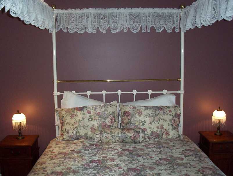 This magnificent four-post queen size antique bed will enchant any of our guests.