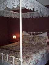 This magnificent four-post queen size antique bed will enchant any of our guests.