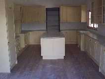 The Kitchen has been installed, notice the timber floor.