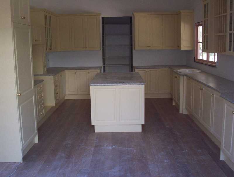 The Kitchen has been installed, notice the timber floor.