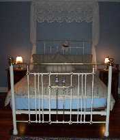 This breathtaking two-post queen size antique bed is in the main bedroom.