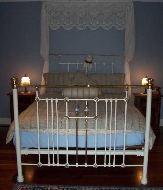 This breathtaking two-post queen size antique bed is in the main bedroom.