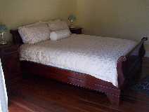 This beautiful queen size sleigh bed will charm any of our guests.