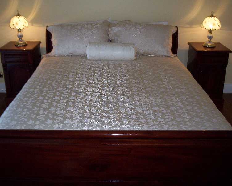 This beautiful queen size sleigh bed will charm any of our guests.