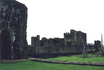 Siege engines add their somber silhouettes to the view