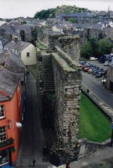 The city wall runs off to the north from the castle