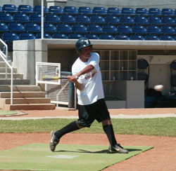 baseaball player swinging