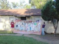 Amy & Kirsten hold up the banner