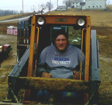 Sean in a bobcat