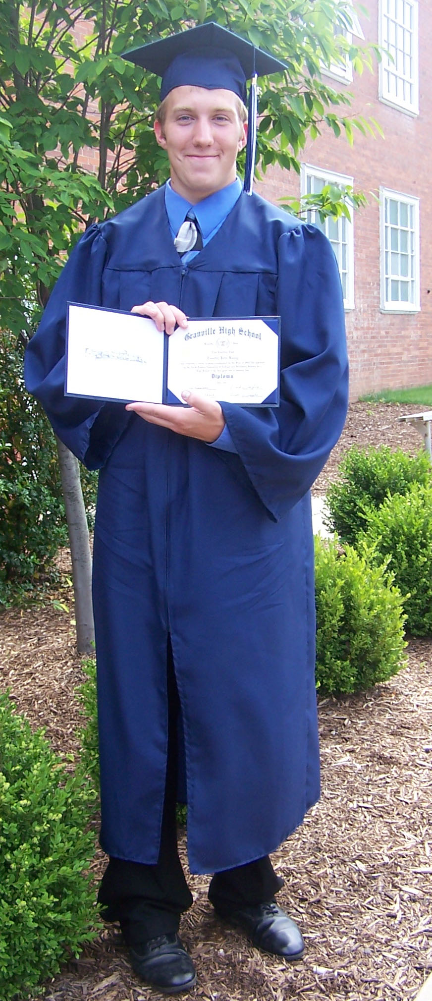 TJ graduating from high school