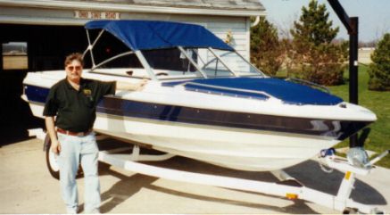 Picture of our new boat in front of the garage