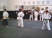 Danny Ruth, Landan Mitchell, and Chad Aurell deomonstrate basics at the karate deomstration