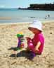 Alice is sun-safe at the beach.