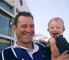 Caleb (15 months) with his dad Robin at Albany stadium: prediction holds he will be taller than his dad one day - now THAT'S tall!