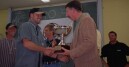 Torsten Schulz accepts the championship cup