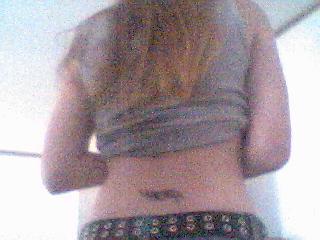the back of me wearing low rise jeans