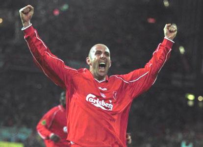 Macca celebrates as he scores from the spot