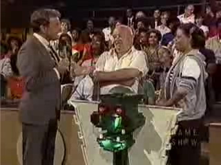 Which of these 2 audience members will find the dragon and pocket some change?