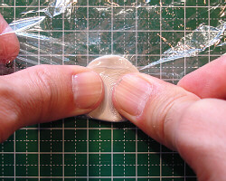 Kneading metal clay.