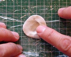 Kneading metal clay.