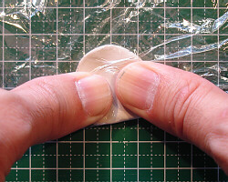Kneading metal clay.