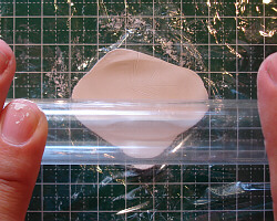 Kneading metal clay.