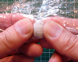 Kneading metal clay.