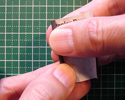 Sanding with a rolled piece of sandpaper.