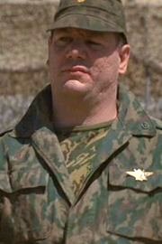 Claude-Oliver Rudolph as Colonel Akakievich