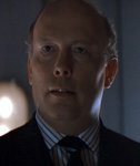 Julian Fellowes as the Minister of Defense
