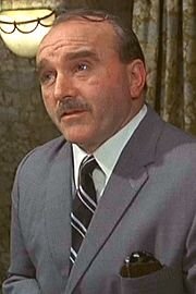 Gerald James as Professor Fraizer