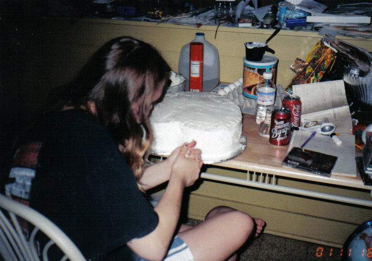 Katcha finishing up the wedding cake