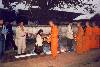 Giving alms.