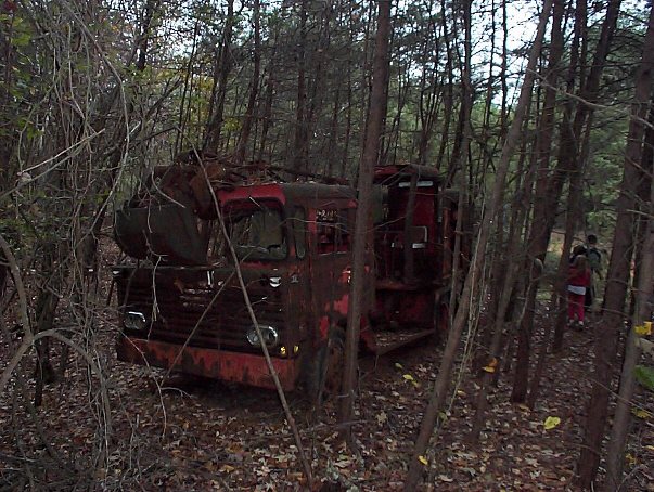 abandoned red Link Belt truck