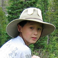 Sebastian riding horse in Glacier National Park